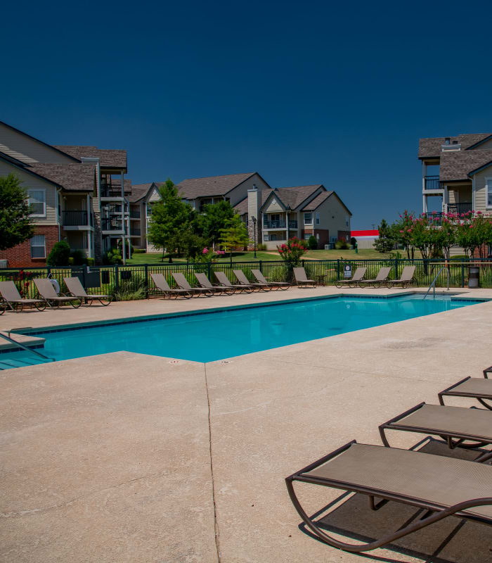 Sparkling pool and sundeck outside of Villas at Stonebridge in Edmond, Oklahoma