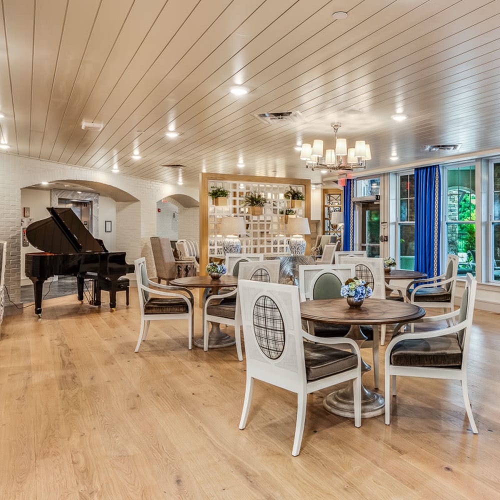 Community room with piano and plenty of seating at Anthology of Louisville in Louisville, Kentucky