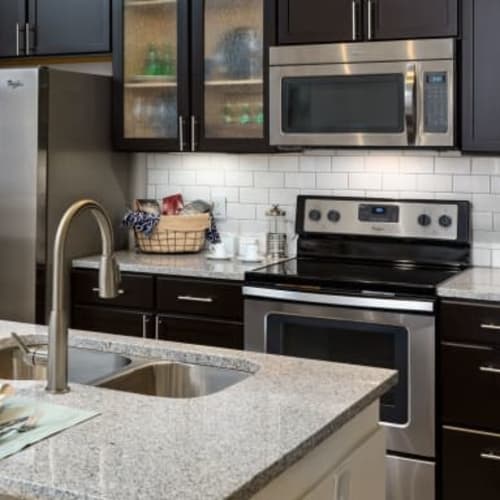 Modern kitchen with stainless steel appliances at Haywood Reserve Apartment Homes in Greenville, South Carolina