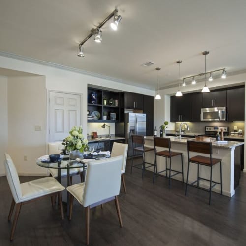 Open concept living space with a dining table set for four at The Crossing at Katy Ranch in Katy, Texas