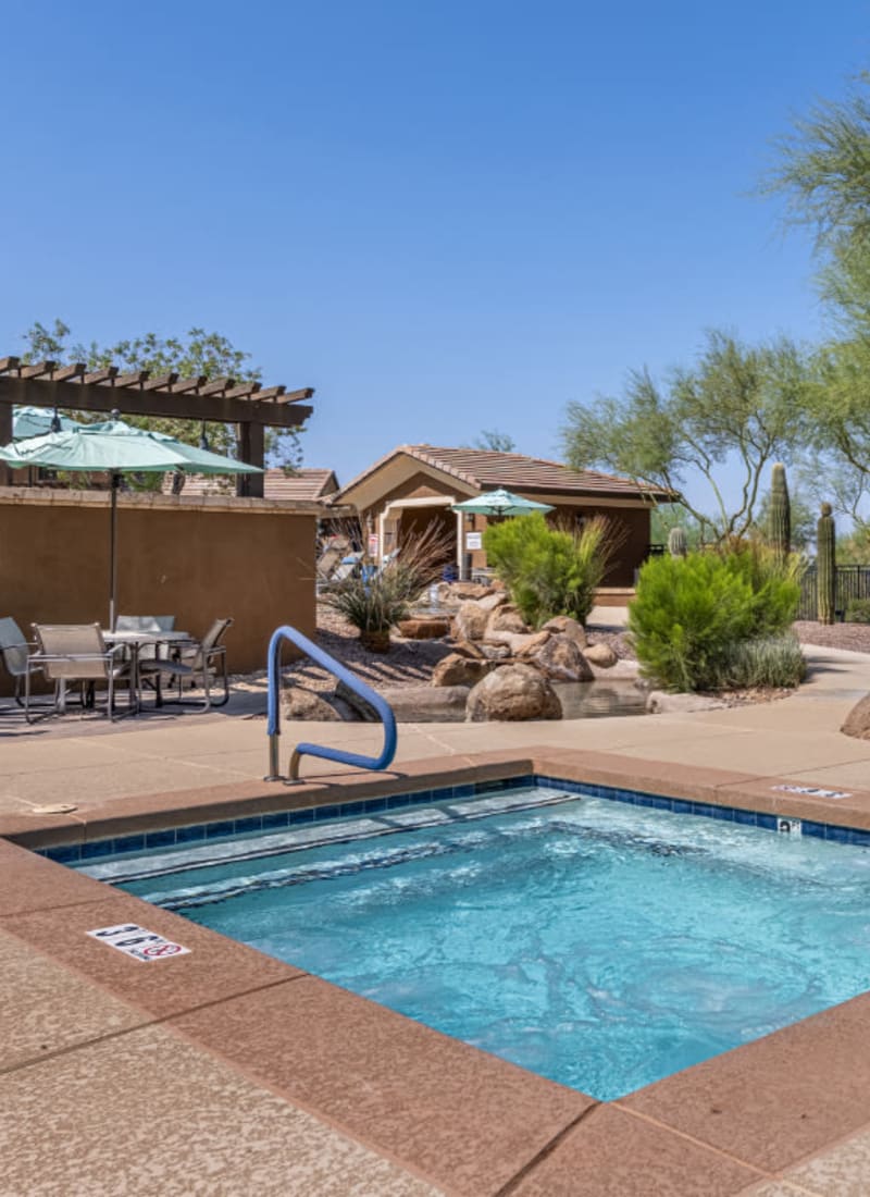 Hot tub next to community BBQ area at Marquis at Sonoran Preserve in Phoenix, Arizona