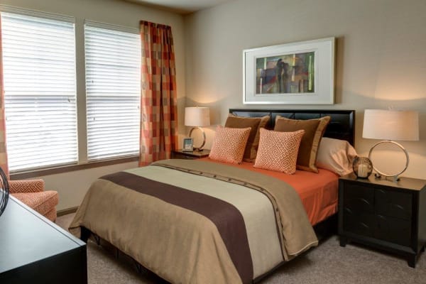 Spacious living room with plush carpeting at The Addison at South Tryon in Charlotte, North Carolina