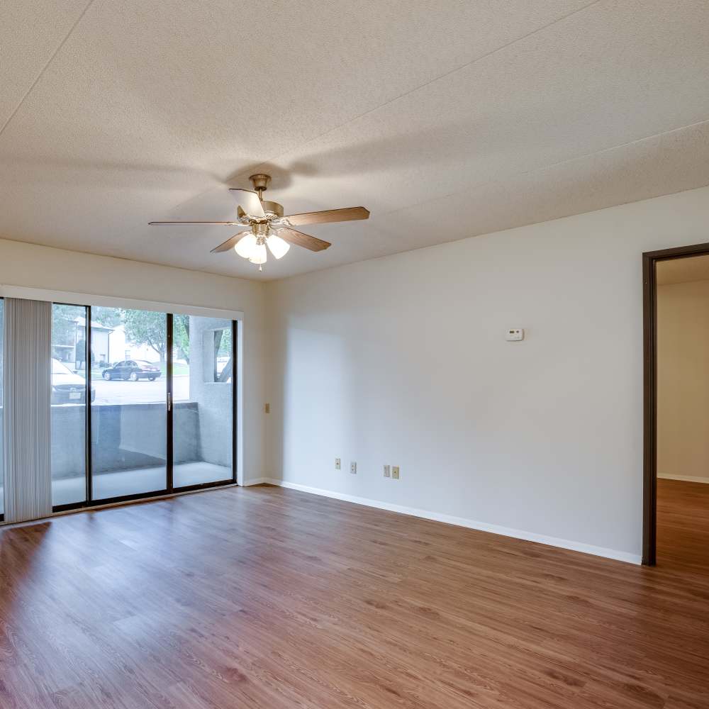 Living room with balcony access at Germantown Gardens in East Ridge, Tennessee