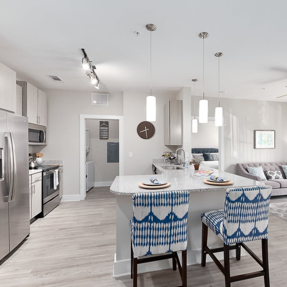 Bar seating in an apartment kitchen at The Lively Indigo Run in Ladson, South Carolina