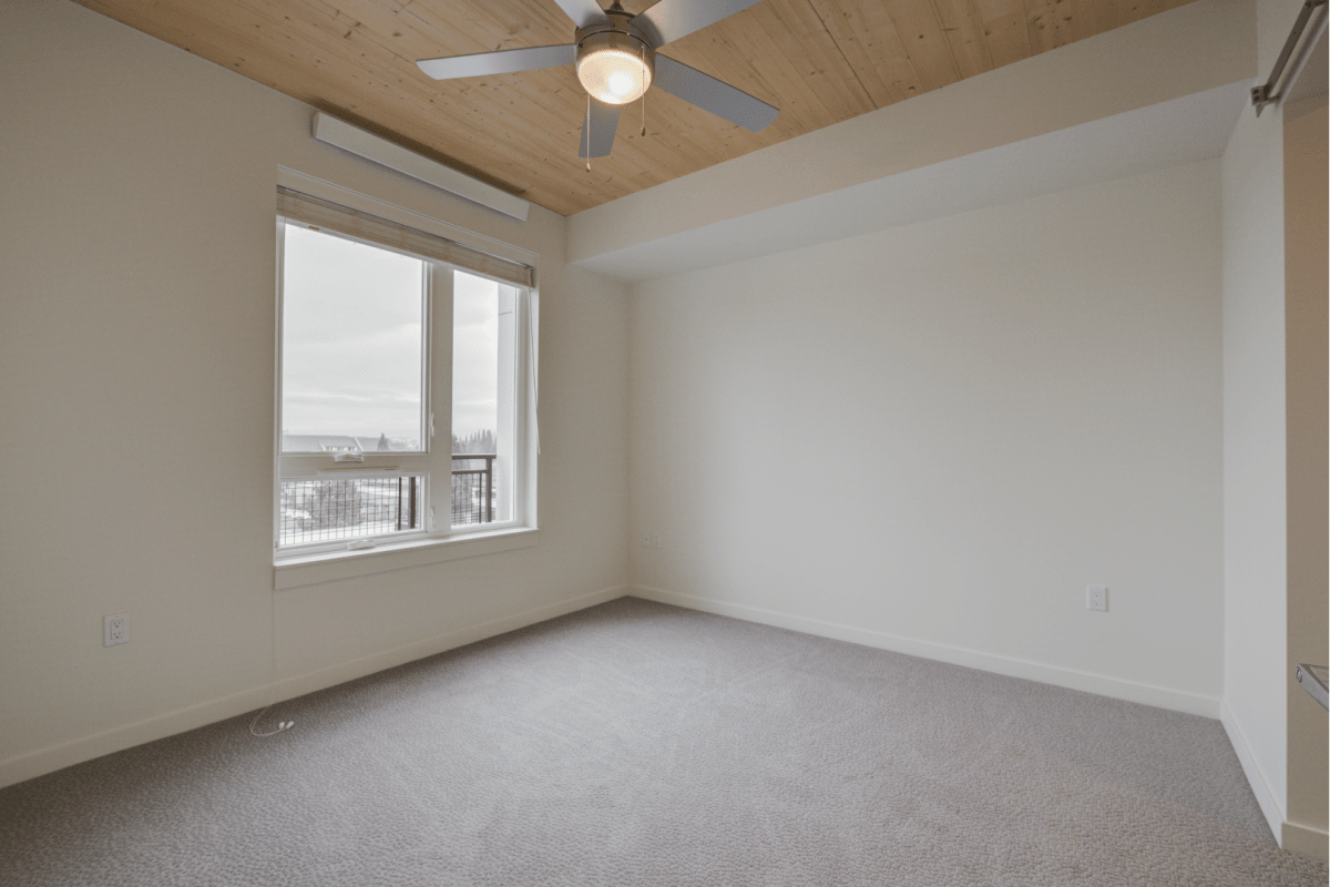 A carpeted bedroom space at The Quarry in Hillsboro, Oregon