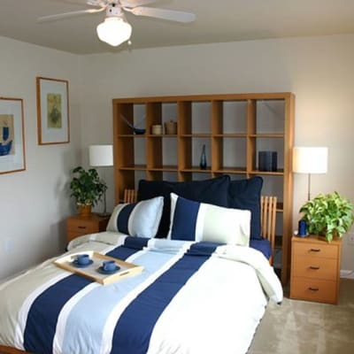 A well-lit bedroom at The Village at NTC in San Diego, California