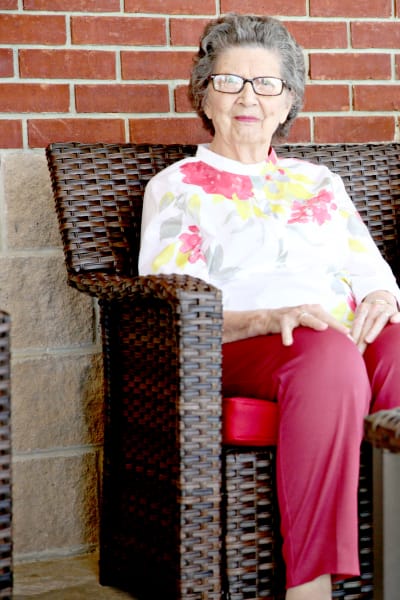 A woman resident sitting outside at Providence Assisted Living in Grenada, Mississippi