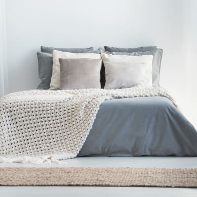 Minimalist decor in the bedroom of a model home at Sofi Canyon Hills in San Diego, California