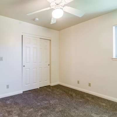 A well-lit bedroom in a home at O'Neill Heights East in Oceanside, California