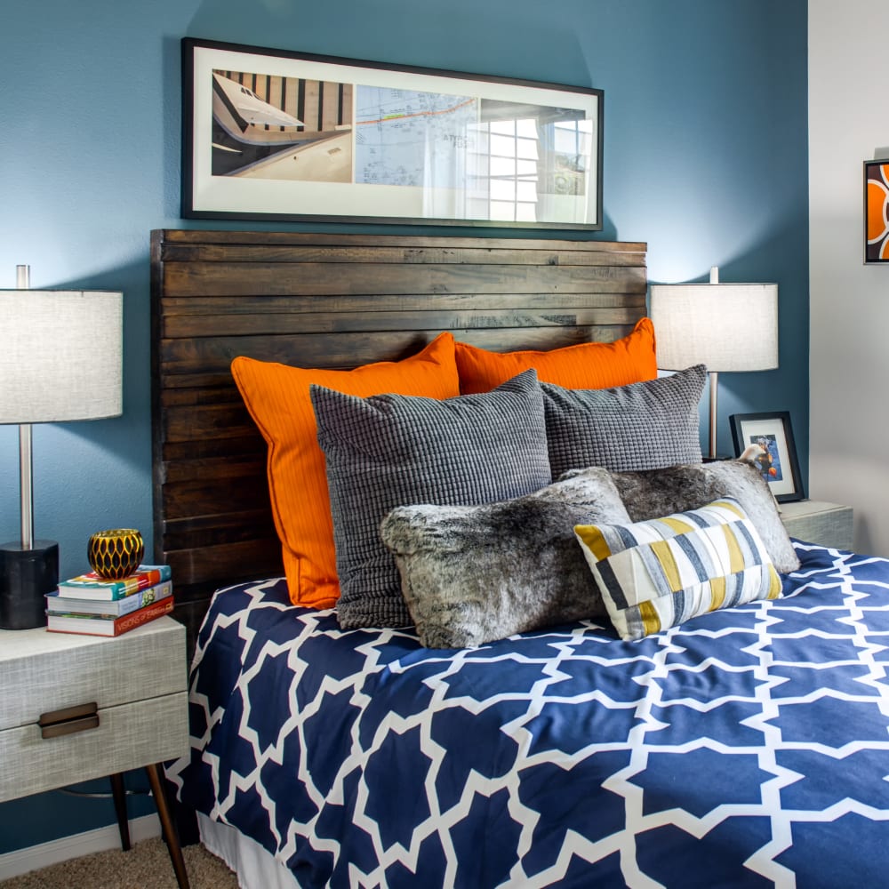 Colorfully decorated bedroom with an accent wall in a model home at Sofi at Cedar Mill in Portland, Oregon