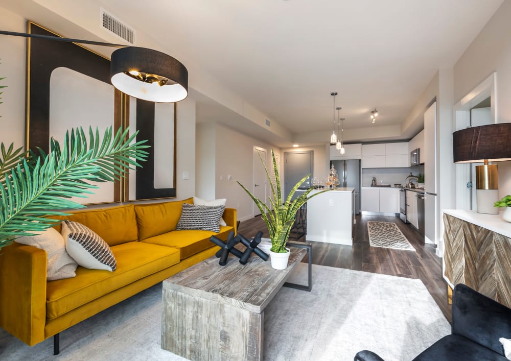 Living room and kitchen with plank flooring at Motif in Fort Lauderdale, Florida