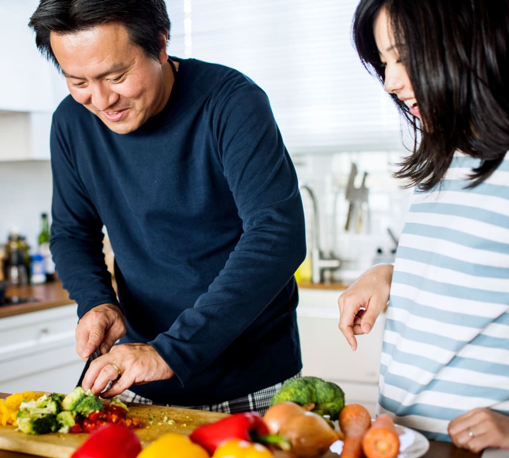 Family cooking together at London Court Apartments in Merrimack, New Hampshire