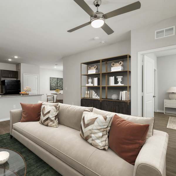Modern living room with access to kitchen at The Janson in Del Valle, Texas 