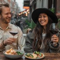 Couple out for a meal at their favorite restaurant near Capri Creek Apartments in Petaluma, California