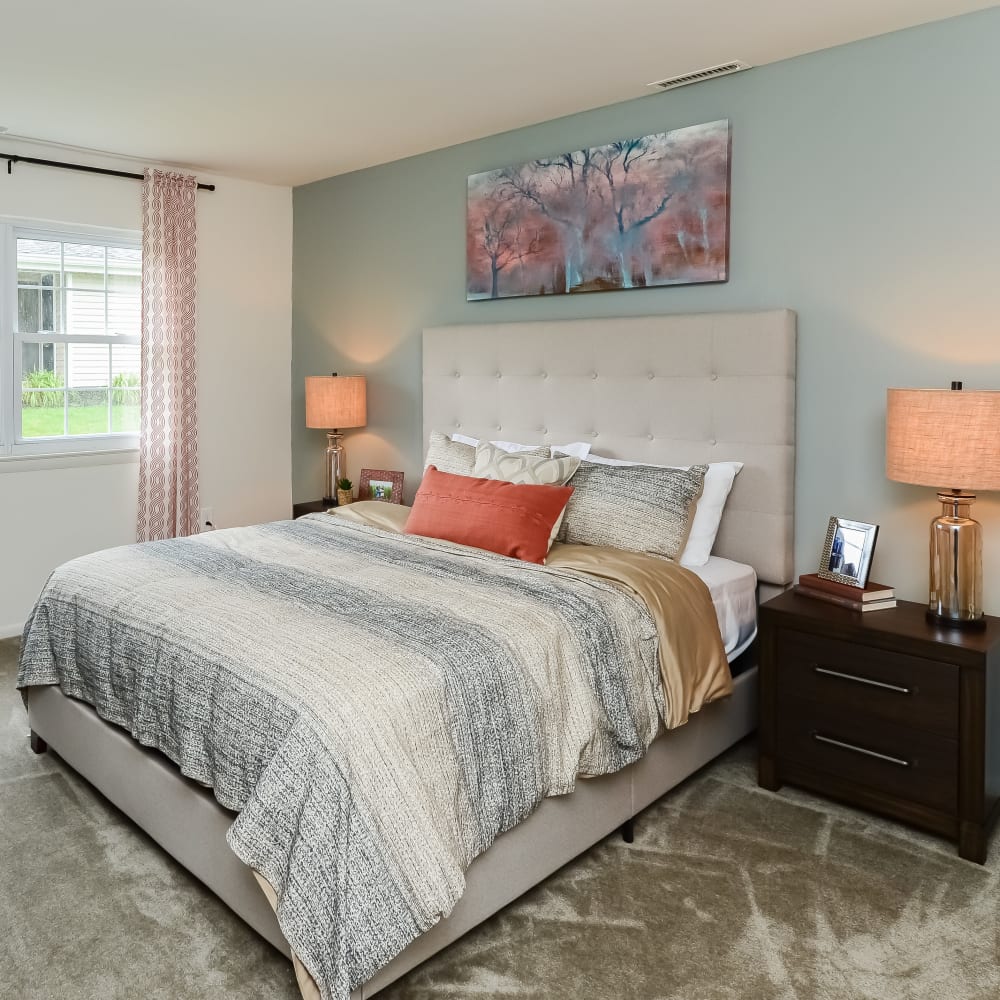 Model bedroom with plush carpeting at Forge Gate Apartment Homes in Lansdale, Pennsylvania