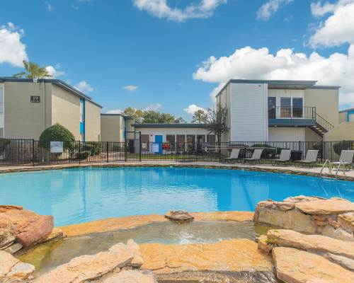 Resort-style swimming pool at Creekside Villas at Clear Lake Apartments in Houston,Texas