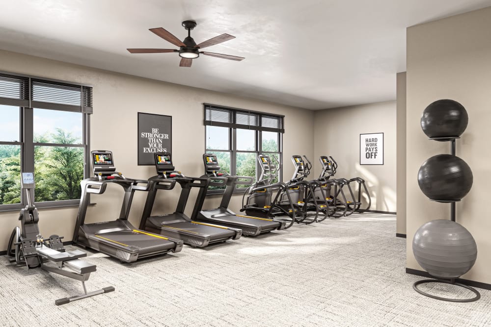 Fitness center with equipment at The Compass at Springdale Park in Richmond, Virginia