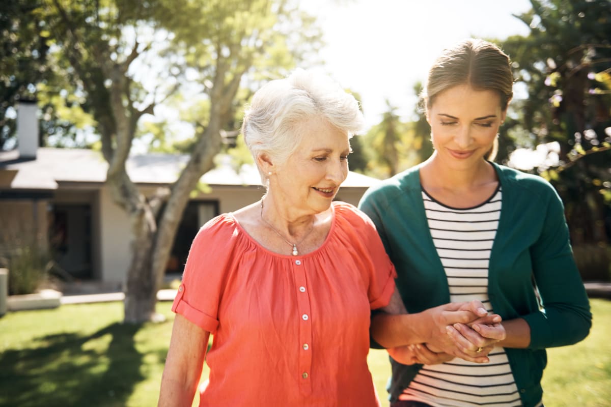 Resident on a walk with a caretaker at Fields Senior Living in Olympia, Washington