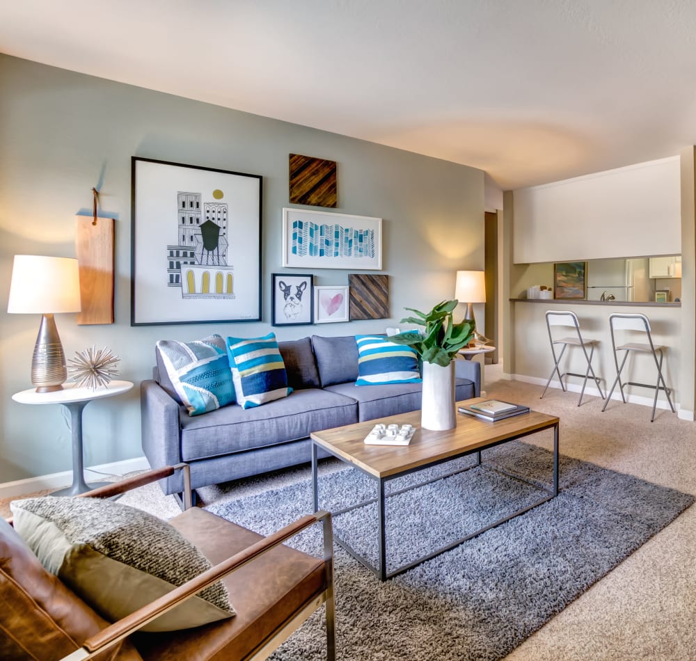 Partial view of the kitchen over the breakfast bar from the living space of a model home at Sofi at Los Gatos Creek in San Jose, California