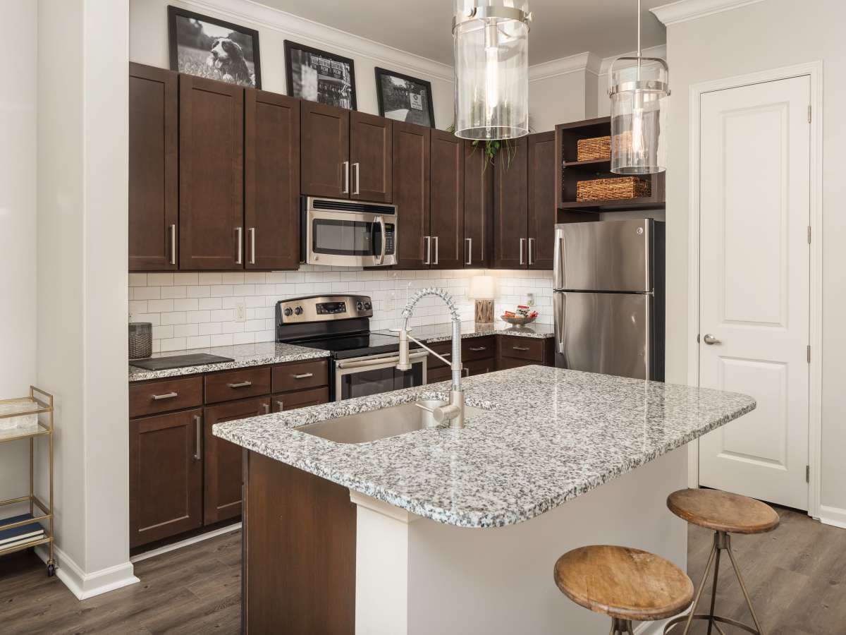 Preparing food on a granite countertop with modern at Ardmore & Twenty Eighth in Atlanta, Georgia