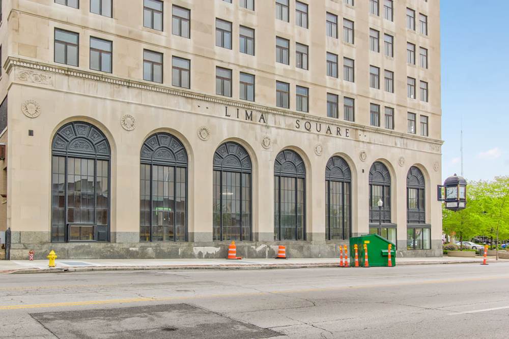 Apartment with large arched windows and decorative stonework at 43 Town Square in Lima, Ohio