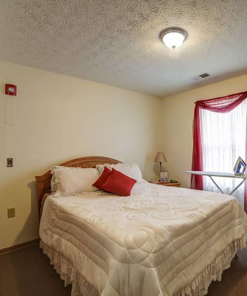 Well-lit bedroom at Madison Grove in Slippery Rock, Pennsylvania