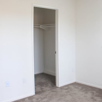 A walk-in closet at Miramar Townhomes in San Diego, California