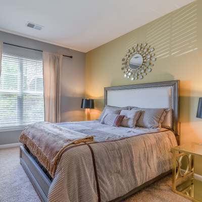 Bright bedroom with large bed at Century Clearbrook, Frederick, Maryland