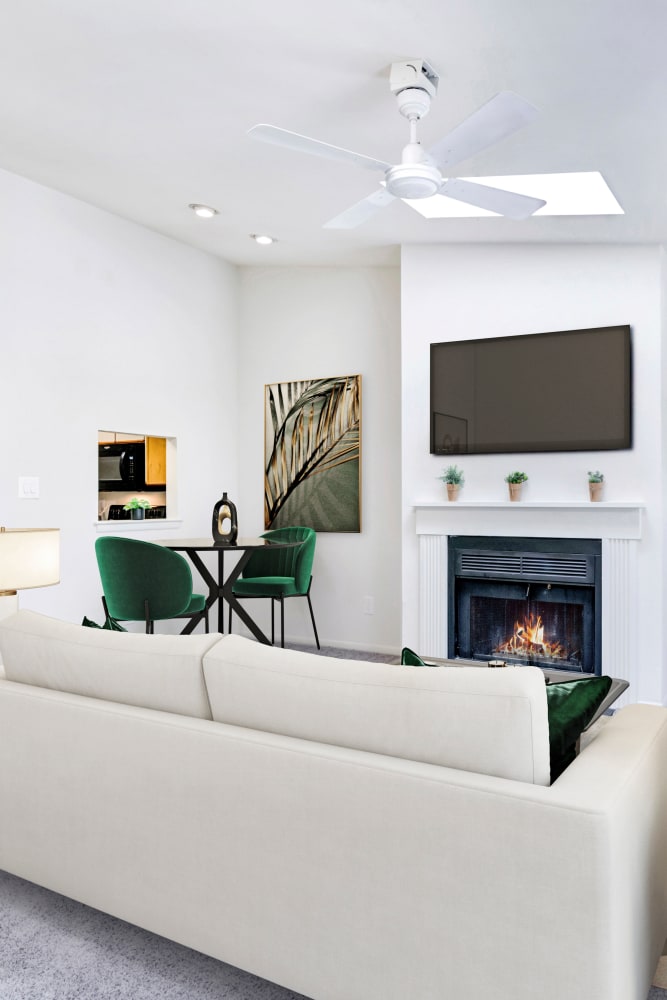 Model living room with wall-to-wall carpeting at Tory Estates Apartment Homes in Clementon, New Jersey