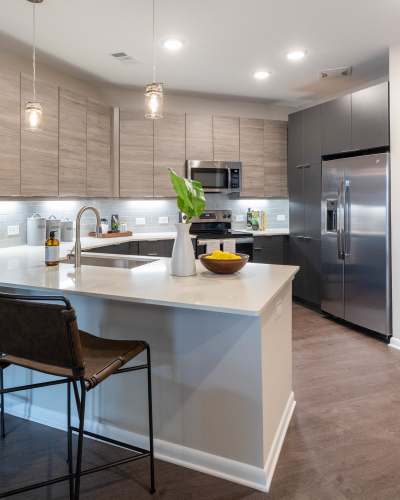 Model kitchen with wood flooring The Jade at Avondale in Decatur, Georgia