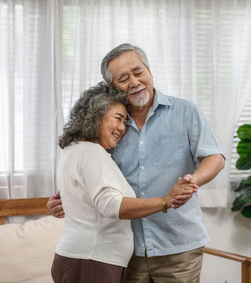 A resident couple dancing at HeatherWood Assisted Living & Memory Care in Eau Claire, Wisconsin. 