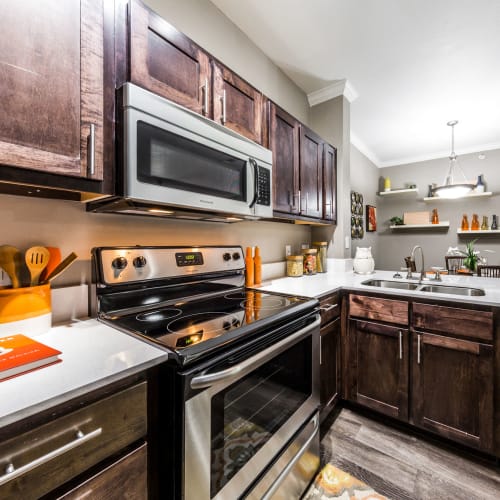 Apartment kitchen at Sycamore Springs in Austin, Texas