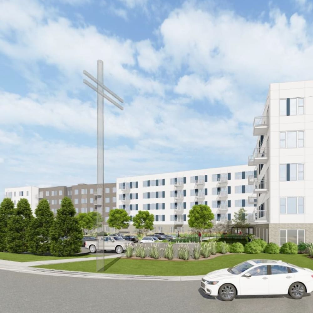 Building exterior view and vehicle on nearby road at The Intersect in Madison, Wisconsin