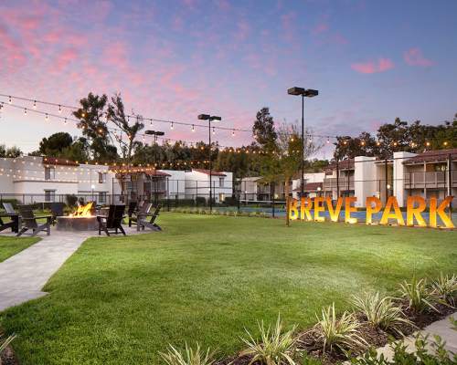 Lawn area with firepit at Breve Park Apartment Homes, Anaheim, California