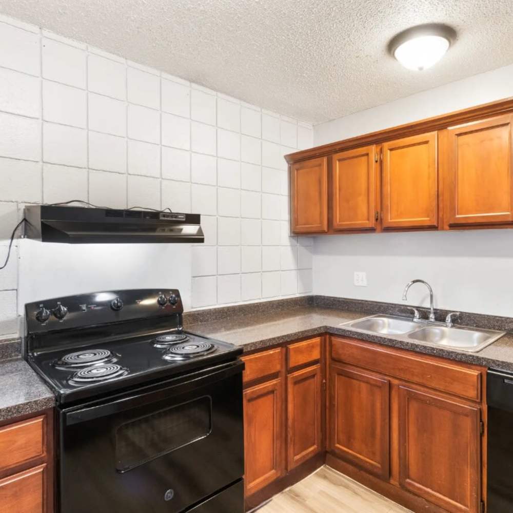 Kitchen with wooden cabinetry at Agave Courtyard in El Paso,Texas