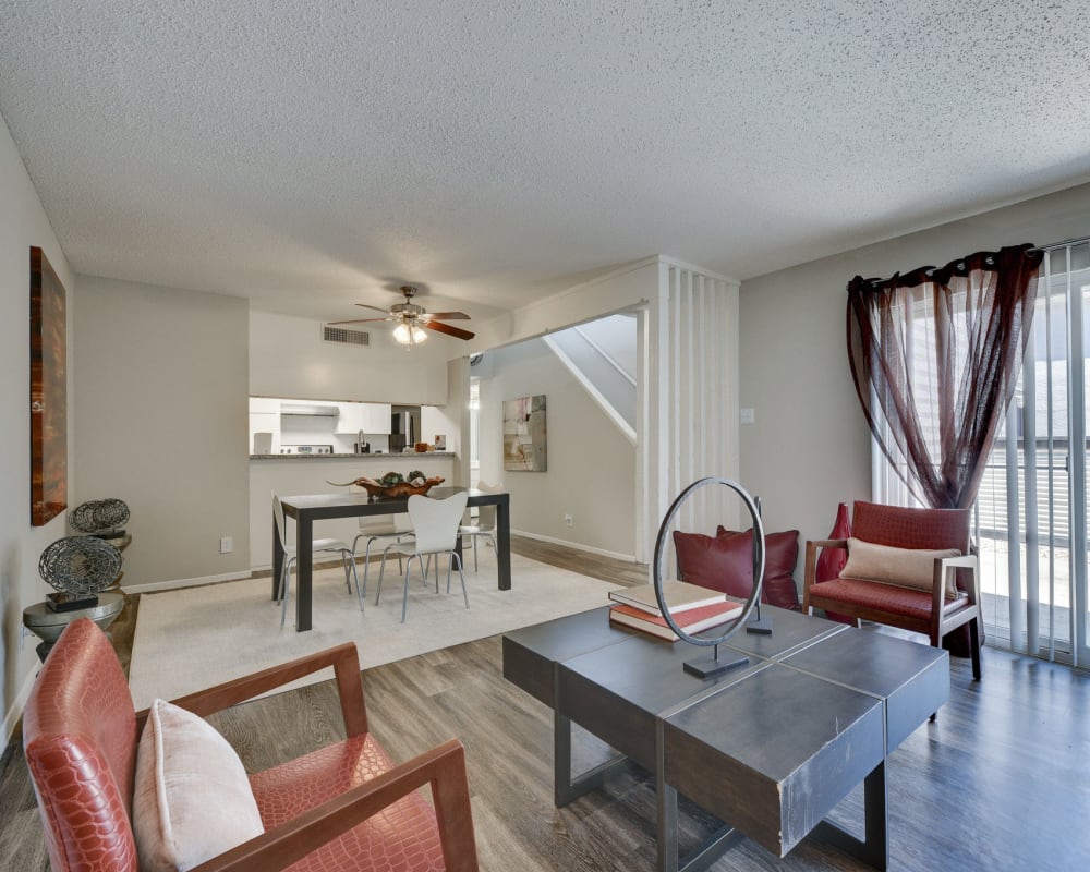 Furnished living room and dining room at The Fredd Townhomes in San Antonio, Texas