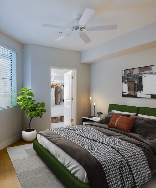 A bright bedroom with a walk-in closet at The Aubrey in Tempe, Arizona