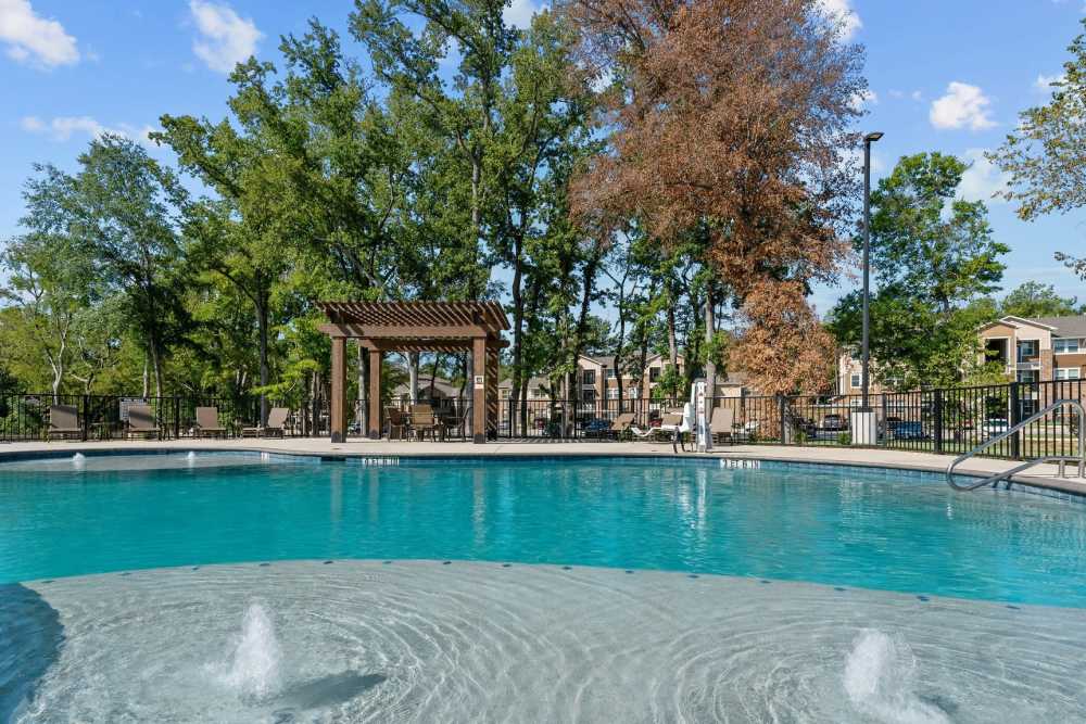 Swimming pool at Pebble Brook Apartments in Jacksonville, Texas