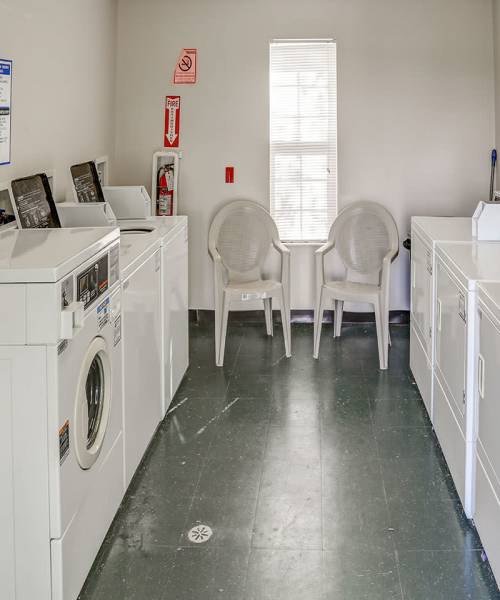 A well-lit on-site laundry area at Heritage Greene in Washington Court House, Ohio