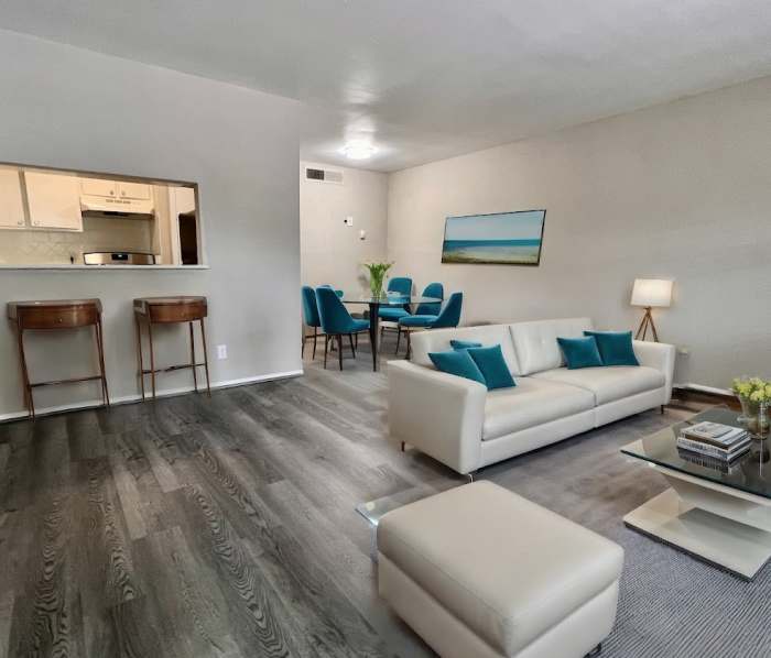Living room with view to dining at The Court at Oak Forest in Houston, Texas