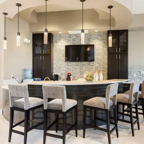 Bar seating in the community lounge at Channelside in Fort Myers, Florida
