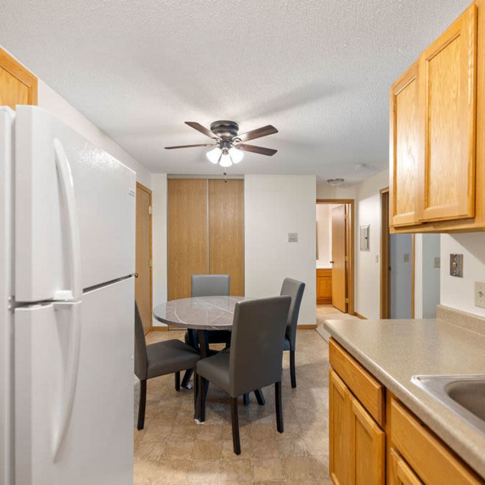 Fully equipped kitchen with white appliances at Solace on Lake Minnetonka in Spring Park, Minnesota