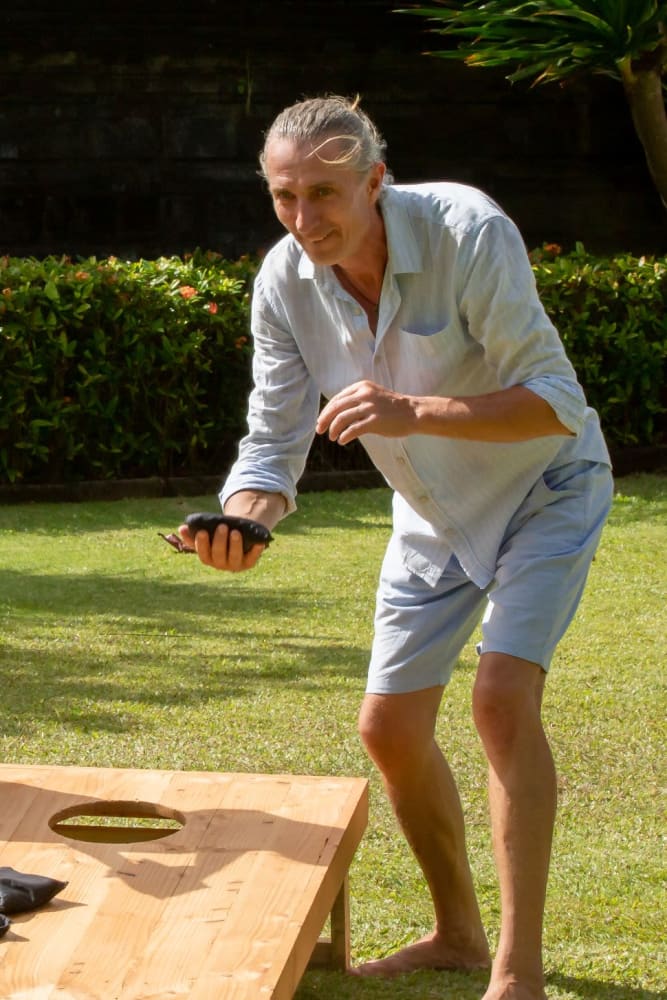 Resident playing cornhole at Sunny Garden Apartments in La Puente, California