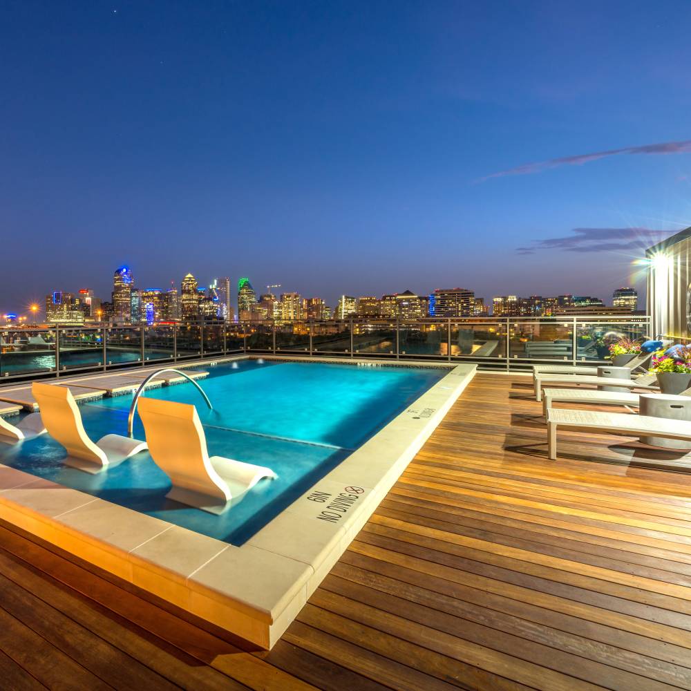 Swimming pool with lounge chairs at Howell Uptown in Dallas,Texas