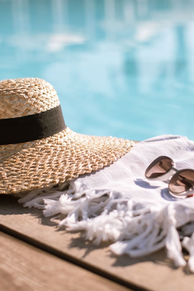 Summer hat and sun glasses at Stoneybrook Apartments in Oceanside, California