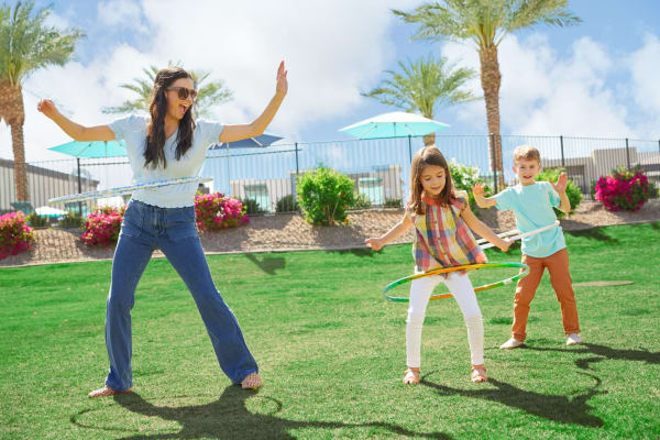 Residents playing at a nearby park at BB Living Union Park in Phoenix, Arizona