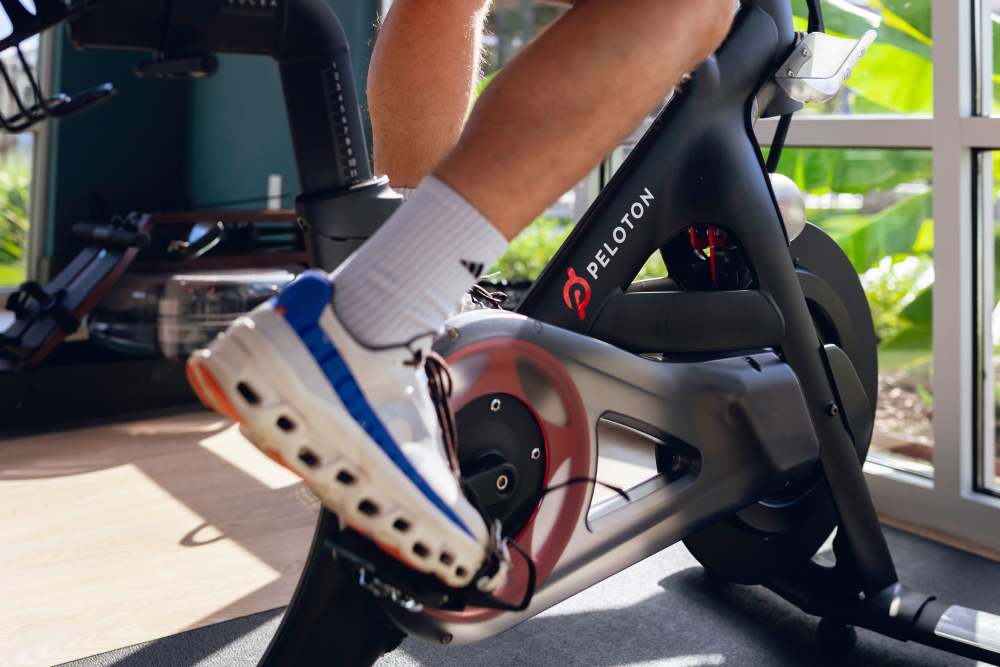 Resident in a community fitness center at The Waters at Promenade in Marrero, Louisiana