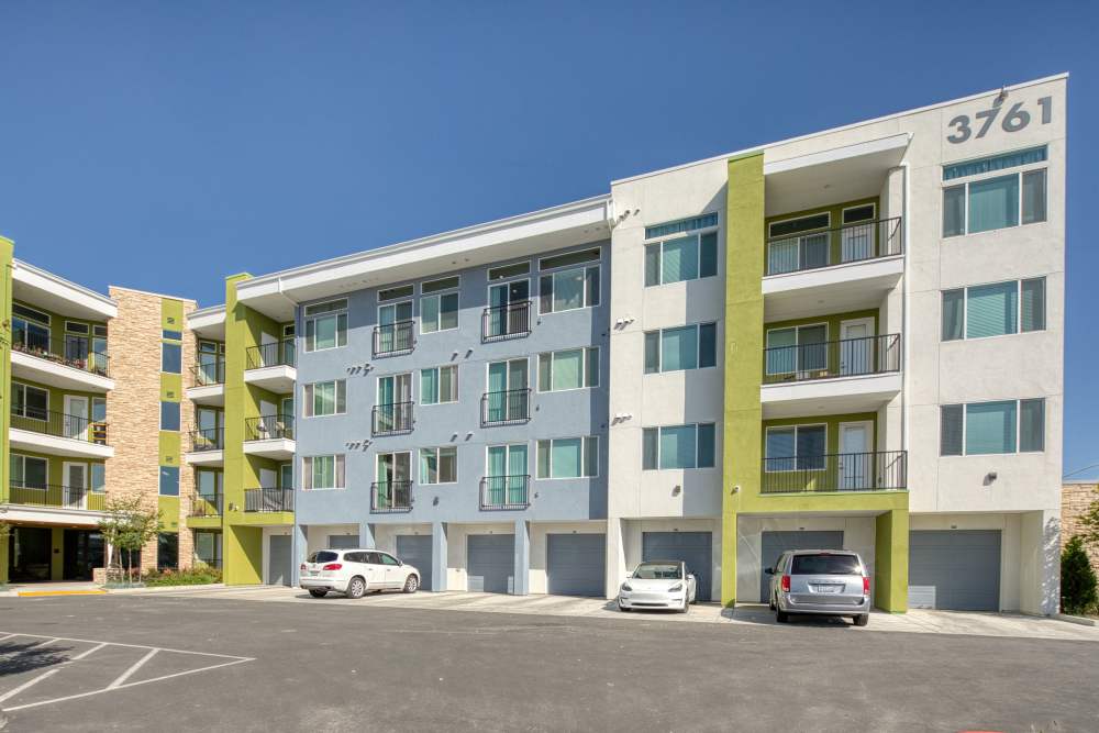 Exterior view of the community with garages at Zeta Luxury Apartments in Sacramento, California