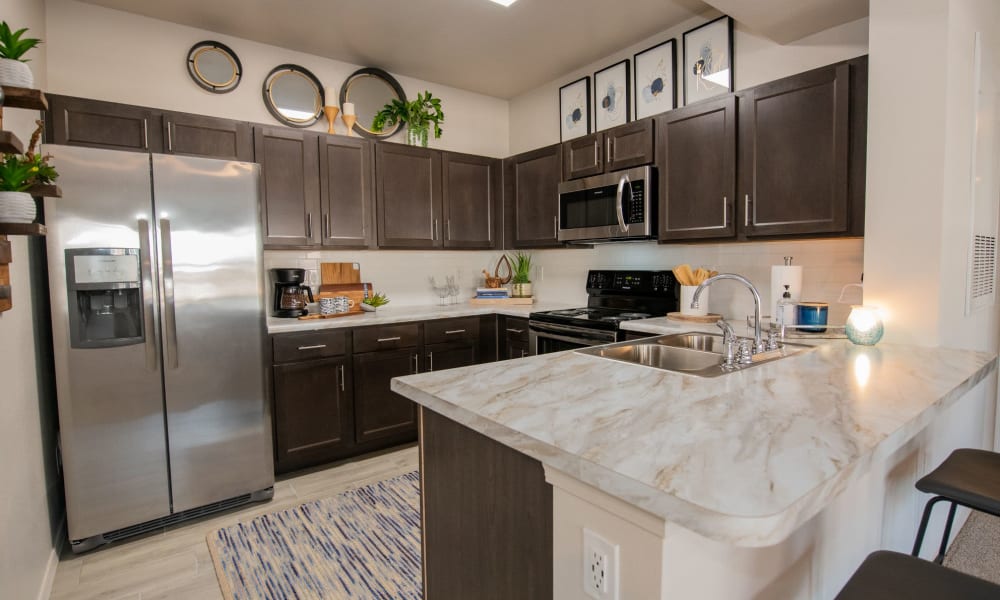 Bright and fully equipped kitchen at Center 301 Apartments in Belton, Missouri