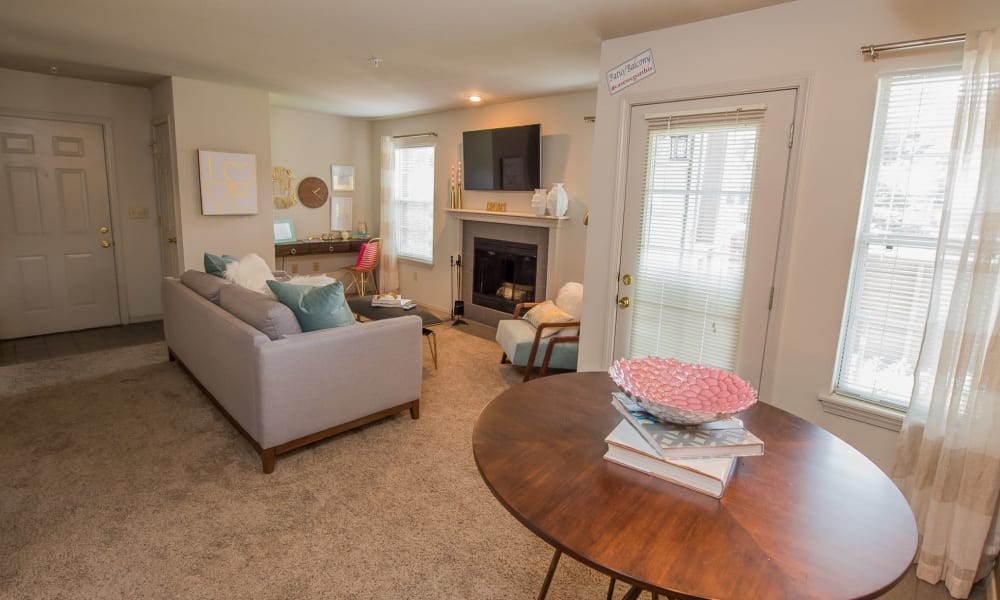 Open and bright model living room at Crown Chase Apartments in Wichita, Kansas